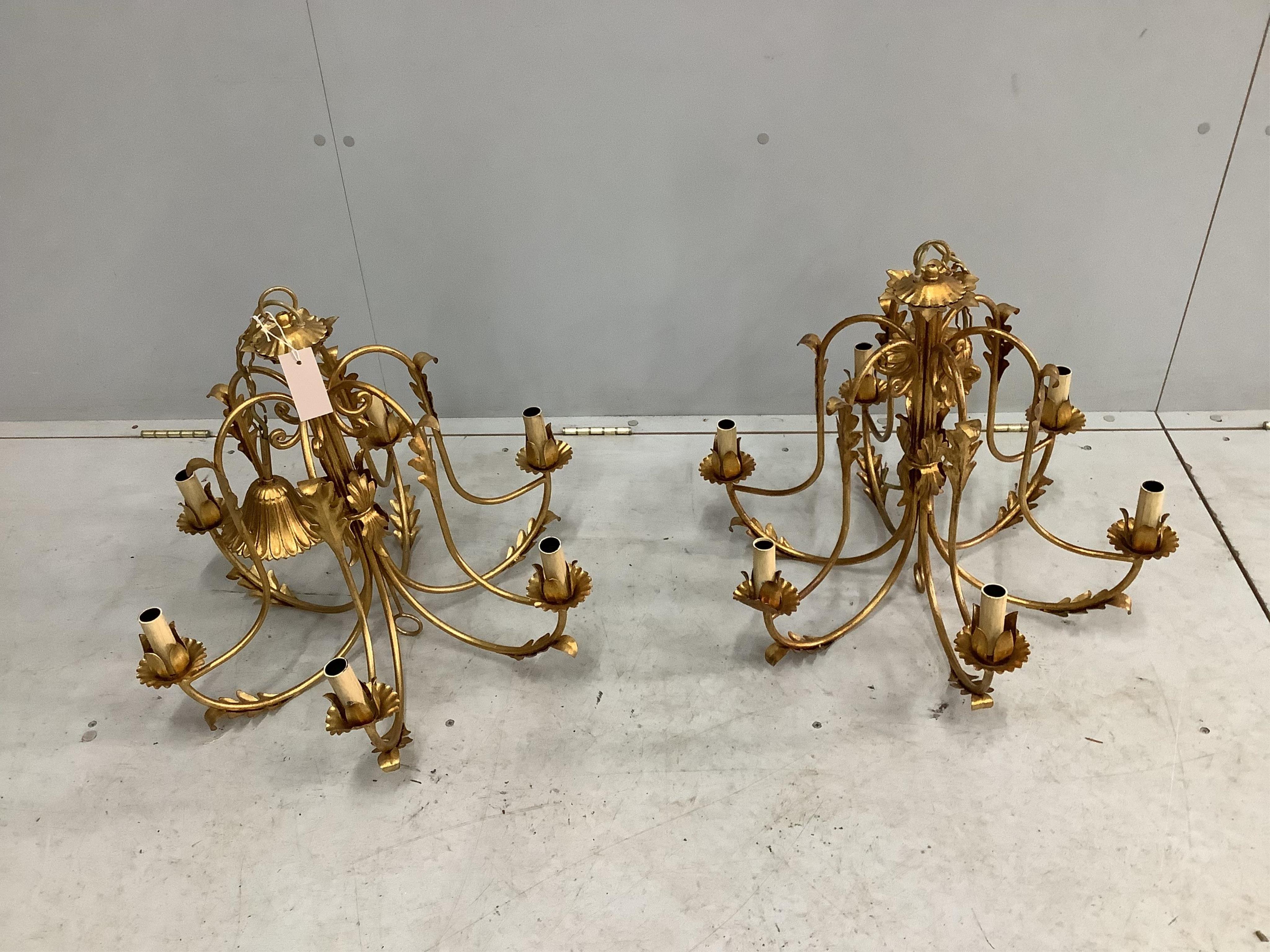 A pair of modern gold painted metal light fittings, diameter 60cm, height overall 80cm. Condition - good